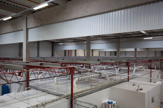 Nano Clean CleanCell 3.x Customised Cleanroom for medical device manufacturing installed in a commercial warehouse with maintenance access walkable ceiling and independent structural steelwork.  