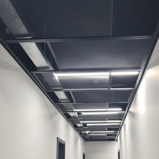 Customised ceiling using mesh panels to create an aesthetically pleasing environment with good building services access. 