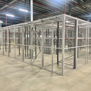 Indoor customised mesh security cage in a warehouse environment with liding mesh panel door and mesh panel ceiling